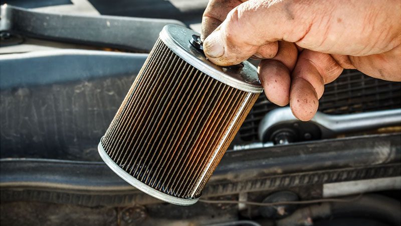 Inspecting the fuel filter for proper spray pattern and operation.
