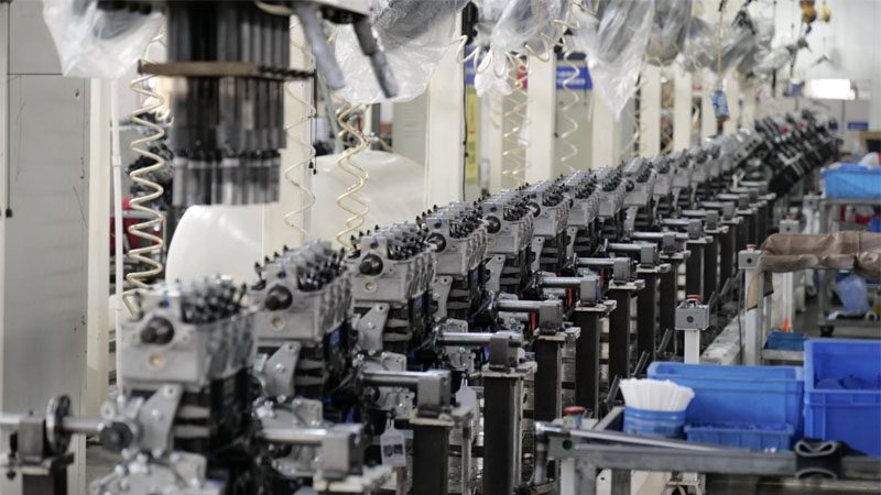 Engine production line at Nanjing Woda Auto Technology Co., Ltd. factory, showcasing the manufacturing process.