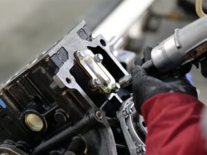 Auto engine production process, focusing on the assembly and precision engineering of automotive engines