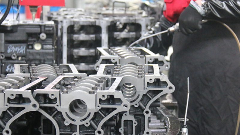 Engine production line at Nanjing Woda Auto Technology Co., Ltd’s factory assembling car engines.