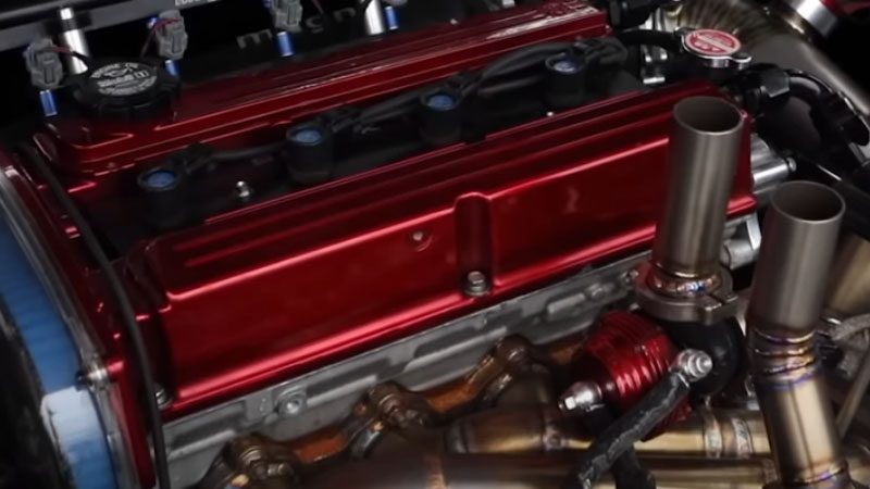 Close-up of an inline four-cylinder engine.