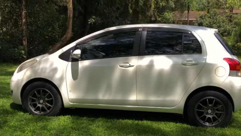 Close-up of a white compact car.