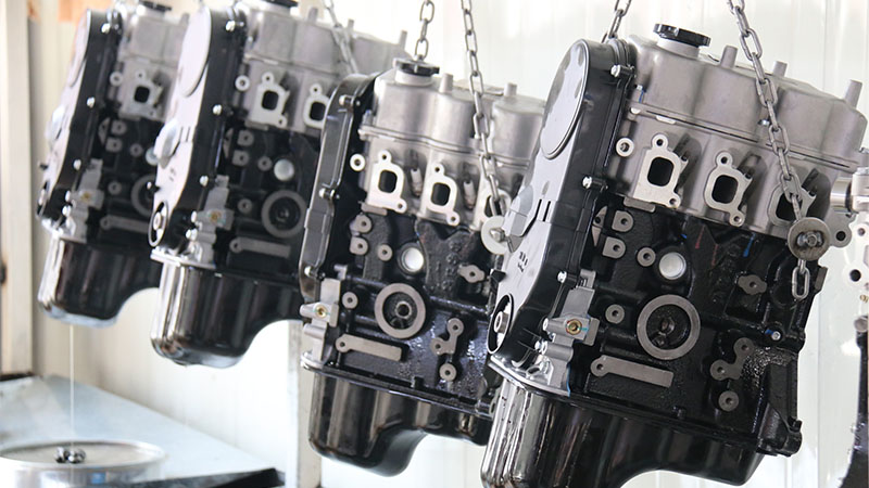 New assembled long block engines lined up on an automotive factory production line.