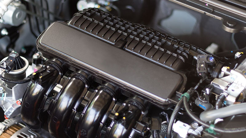 Detailed view of car engine internal components and mechanical design.