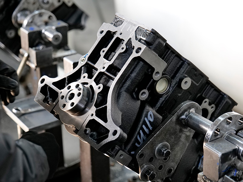 Close-up of engine assembly line showing consistent engine quality control.