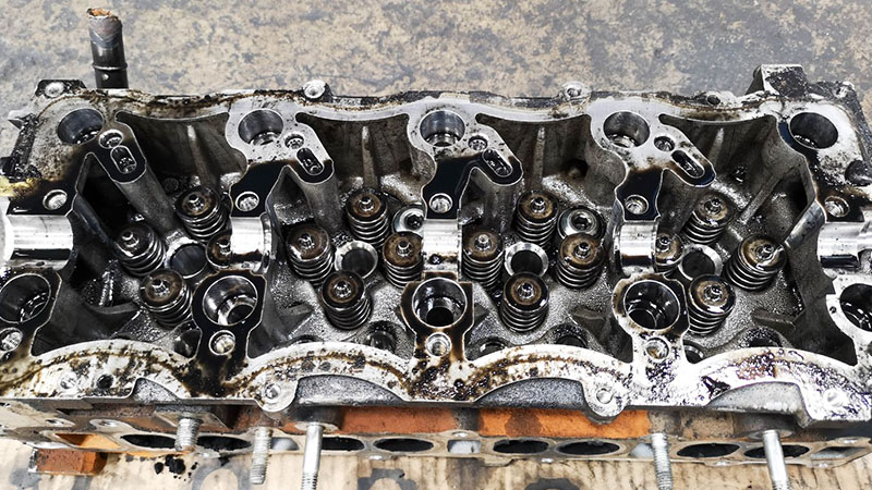 Close-up of a dirty and greasy low-quality engine showing signs of poor maintenance or wear.