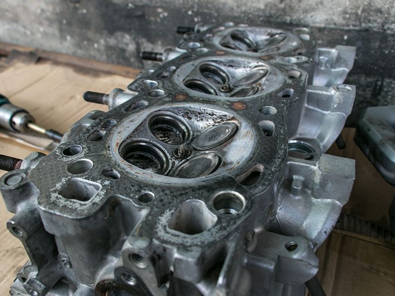 Close up view of an old and cracked cylinder head