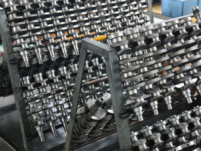Finished crankshafts in bulk displayed at Woda Auto factory