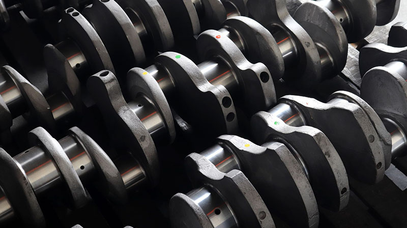Close-up of multiple crankshafts.