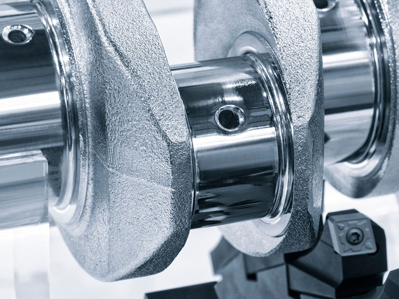 Detailed close-up of crankshaft journals and machined surfaces