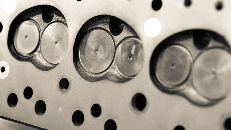 Automotive series engine cylinder head component.