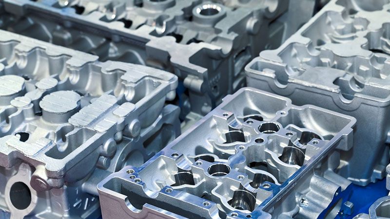 New cylinder heads manufactured on factory production line.
