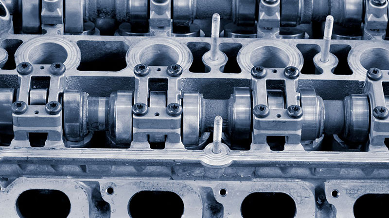 Detailed view of a cylinder head showing precision-engineered components.