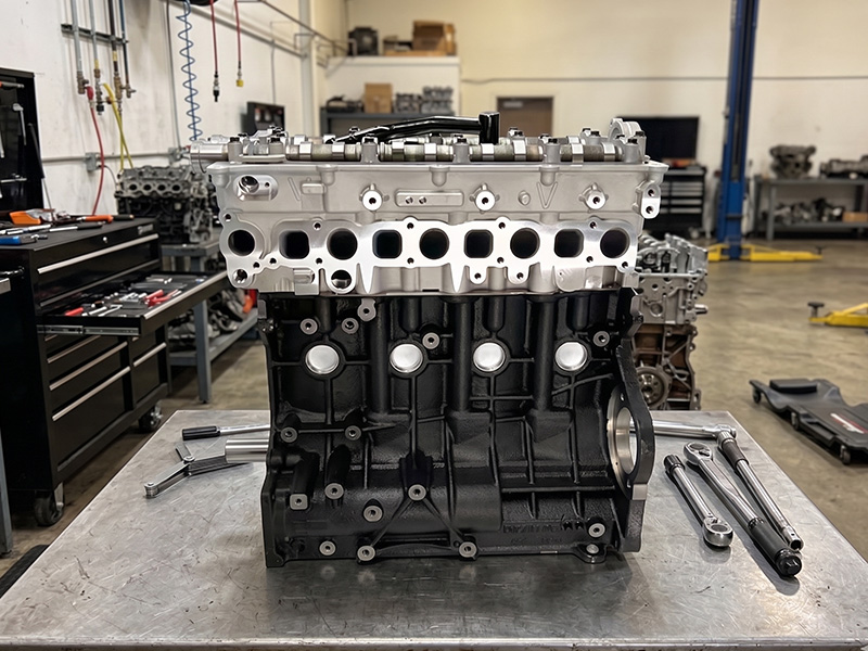 D4CB long block engine displayed at a workshop.