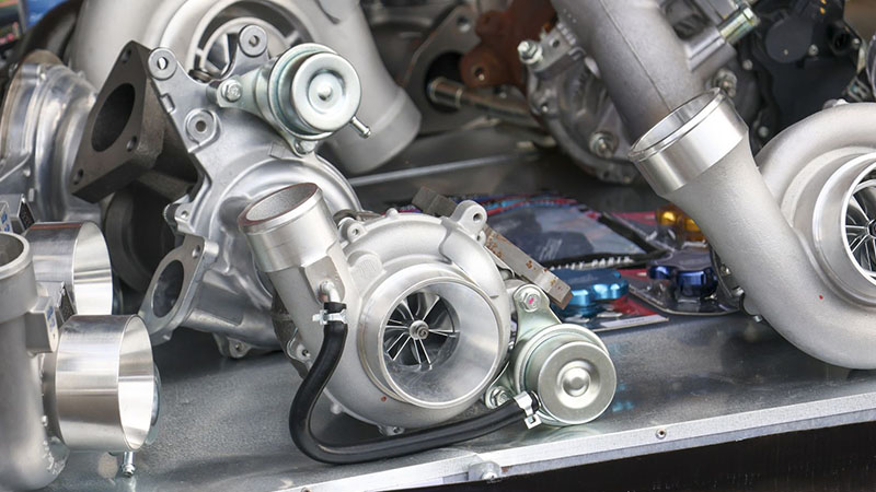 Close-up view of engine turbochargers.