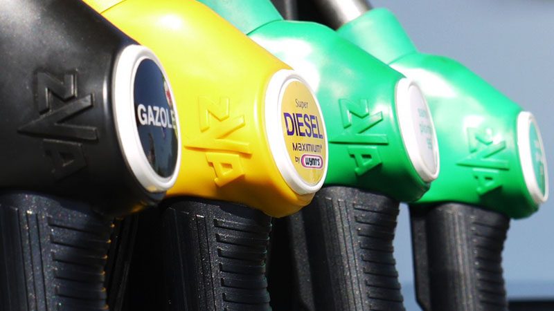 Close-up of different fuel pumps at a gas station