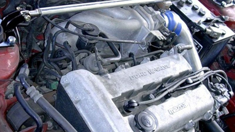 Close-up of a Mazda B6D DOHC engine