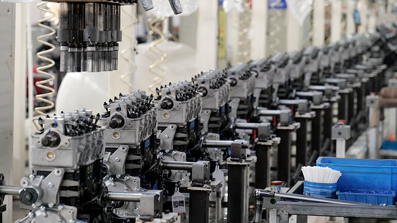 Auto engine assembly line at direct engine supplier factory.