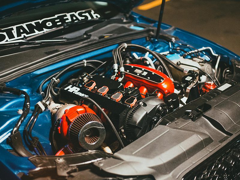 Detailed view of a customized car engine with performance modifications.