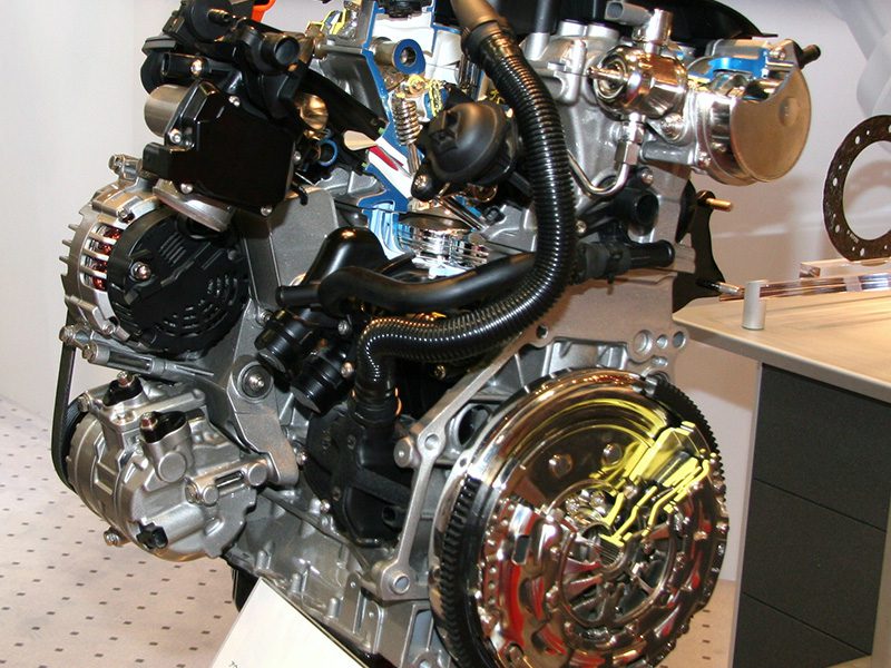 Close-up view of an Audi EA888 turbocharged engine showing detailed components and layout.