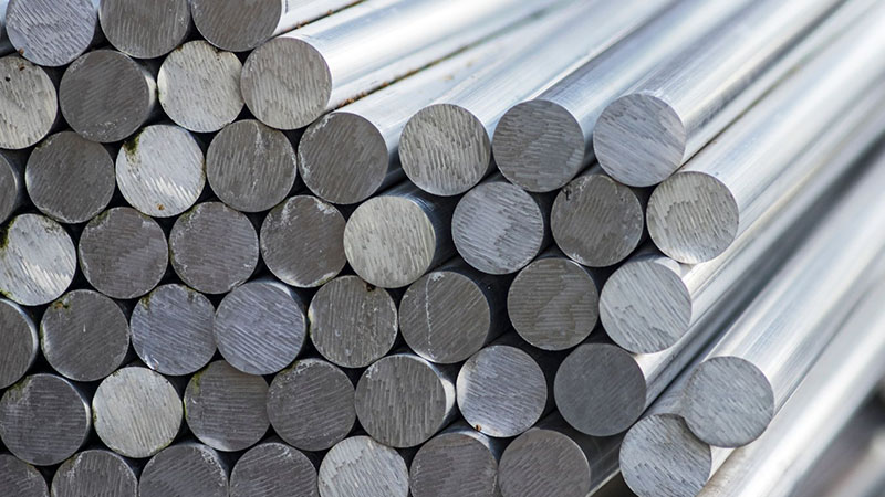 Stack of aluminum bars ready for manufacturing production.