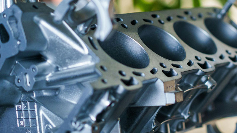 Close-up of an engine block in a workshop setting for inspection and repair.