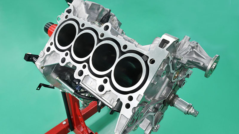 Cylinder block of a 4-cylinder engine for automotive manufacturing inspection.
