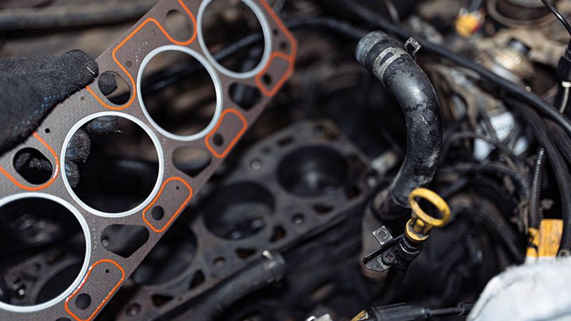 Engine gasket setup during replacement of cylinder block and head gasket.