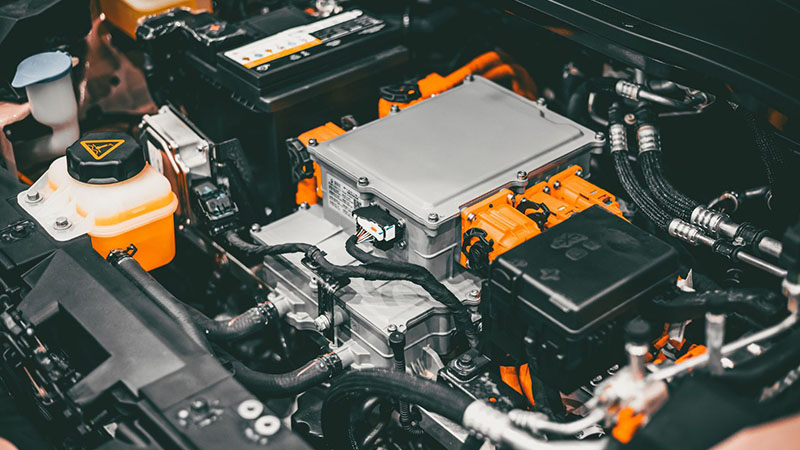 EV engine under the hood of an electric vehicle, showcasing high-power motor technology and zero emissions for environmentally friendly transportation.