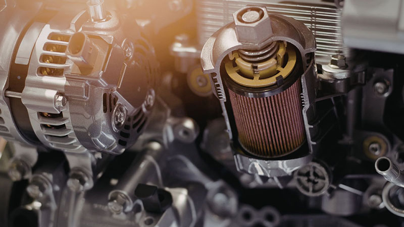 Close-up view of a car air filter used in the engine intake system.