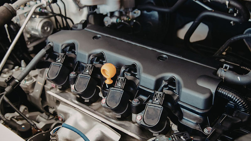 Close-up of car engine ignition system components.