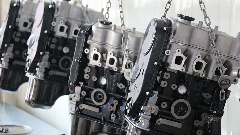 Fully assembled auto engines lined up inside Woda Auto’s factory production area.