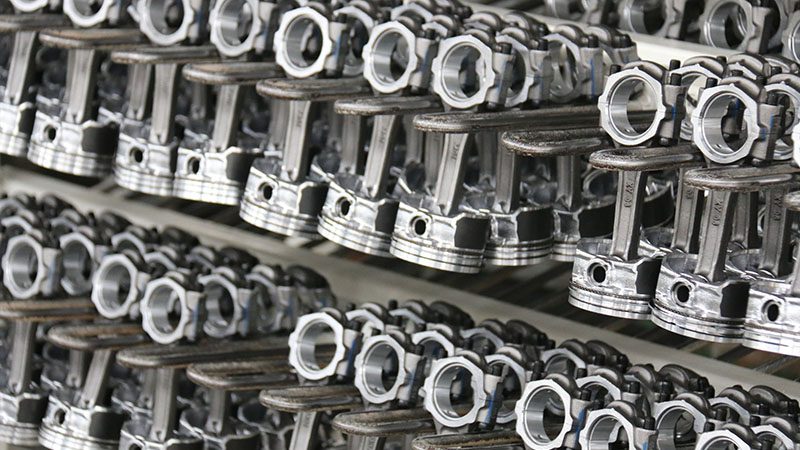 High-quality engine parts neatly displayed at our company’s factory, showcasing components for professional engine repair and replacement.