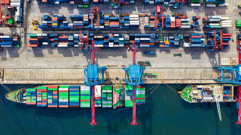 Aerial view of shipping containers for global engine supplier logistics.
