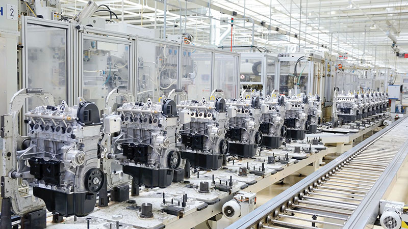 Automotive engine assembly line illustrating manufacturing and quality control in engine production.