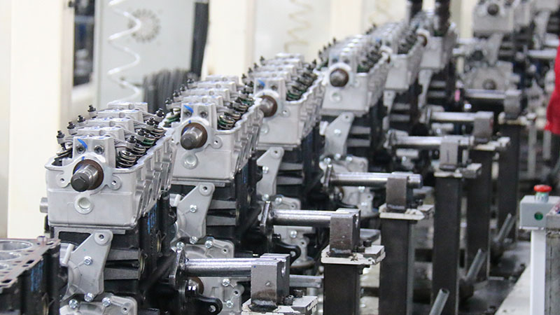 Automotive engine assembly line at Woda Auto factory highlighting production and OEM-level quality control standards.