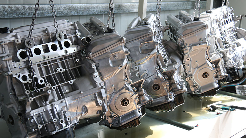 Assembled automotive engines ready for quality testing on Woda Auto factory production line.