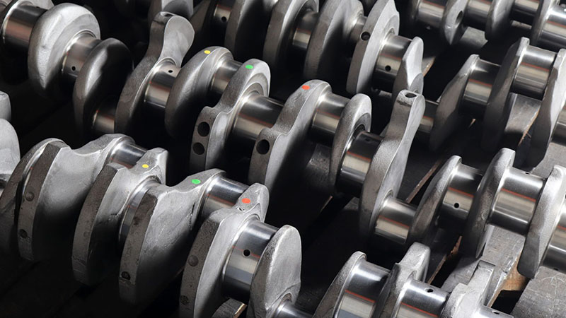 Cast engine components displayed for inspection or assembly.