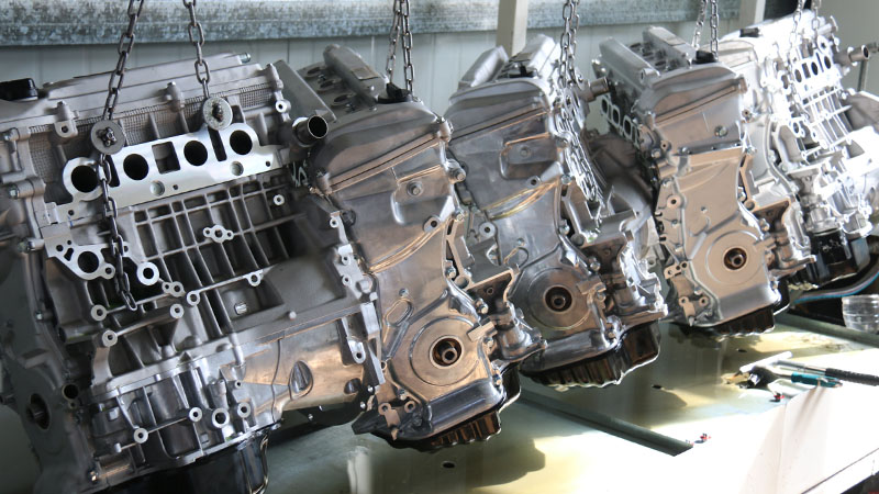 Newly assembled automotive engines lined up at the Woda Auto factory.