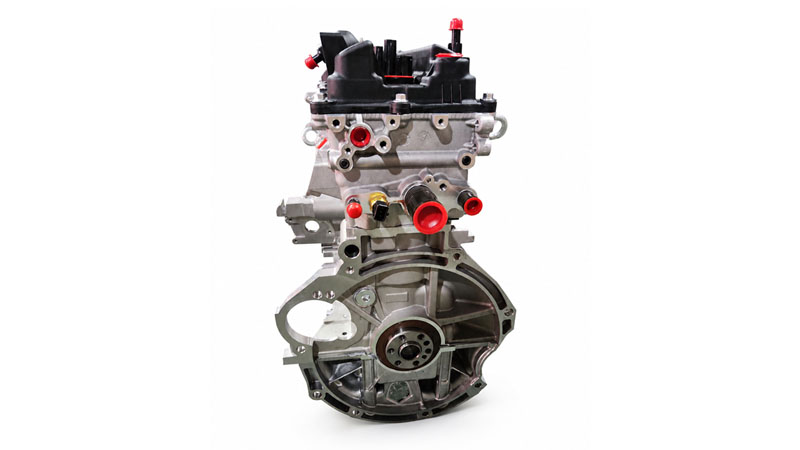 Side view of a G4LA long block engine showing the cylinder block and cylinder head.