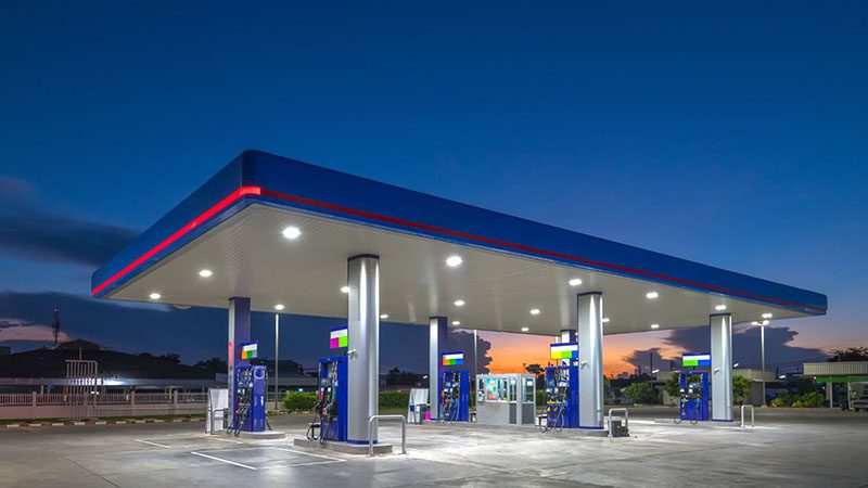 Gas fuel station at sunrise with clear sky.