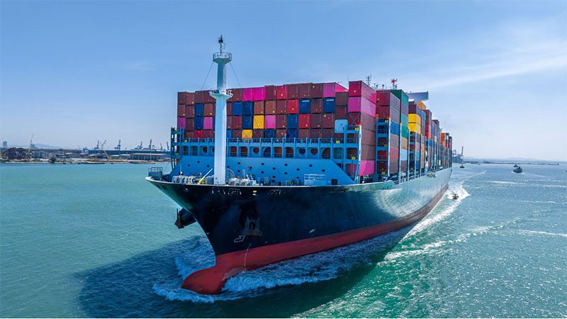 Maritime shipping with fully loaded cargo, highlighting global logistics and transportation of automotive parts and goods.