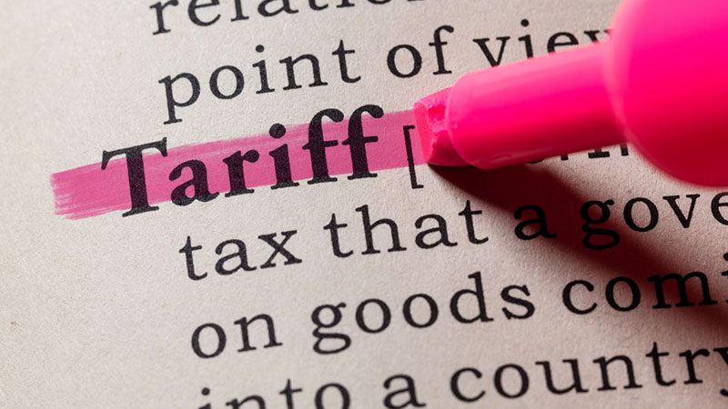 Definition of tariffs in a dictionary, explaining import duties and their impact on international trade.
