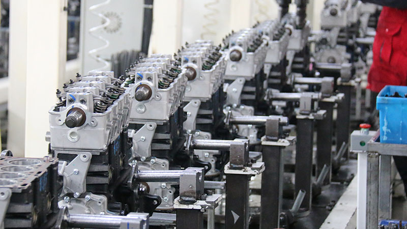 Auto engine assembly line at Woda Auto’s factory, featuring modern production equipment and an organized workflow for engine manufacturing.
