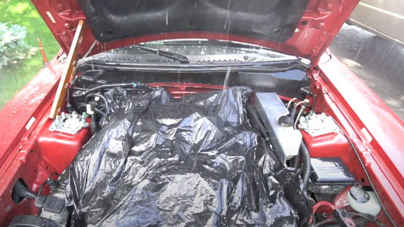 Keeping the engine safe while pressure washing the hood.