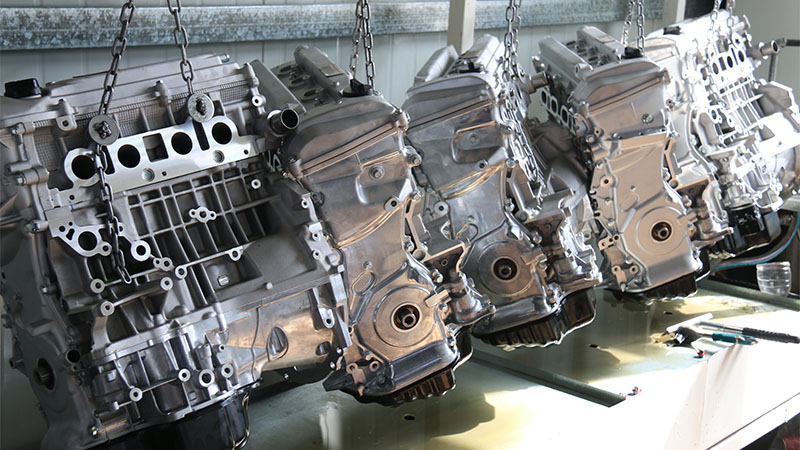 New assembled automotive engines ready for testing at factory.