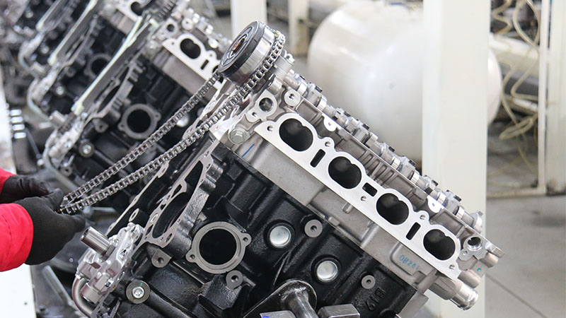 Engine assembly line at automotive manufacturer producing engine components.