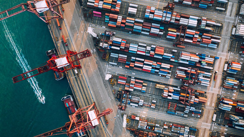 Aerial view of China port with shipping containers for international import and export logistics.