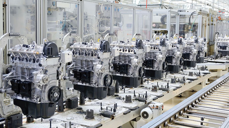 Automotive engine assembly line at manufacturing factory.