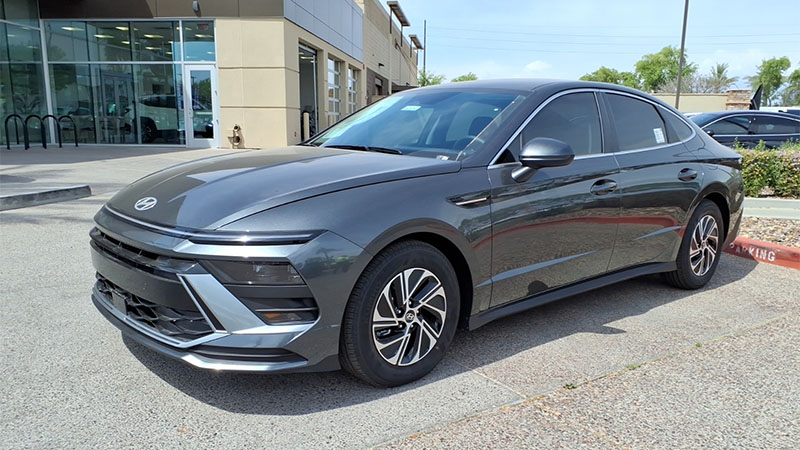 2026 Hyundai Sonata Hybrid Blue sedan, showcasing its exterior design and modern hybrid styling.